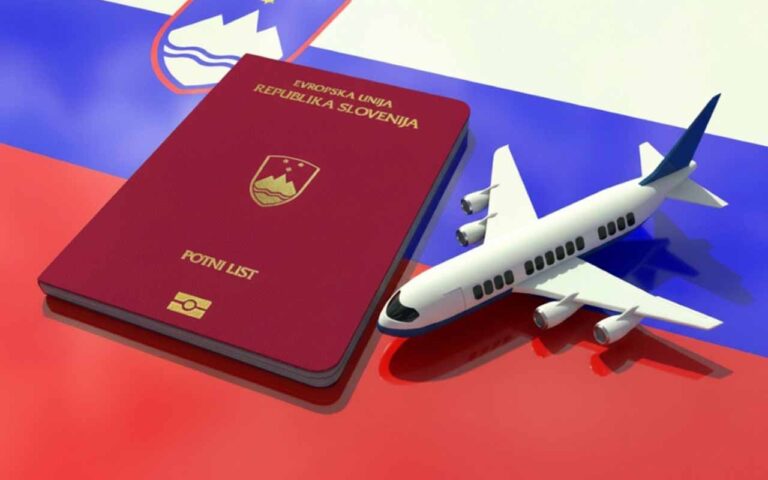 A conceptual illustration visualizing the official application for the Slovenia Nomad Permit, featuring a detailed Republic of Slovenia passport and a vintage biplane resting on an unrolled expedition map, all over the Slovenian national flag.